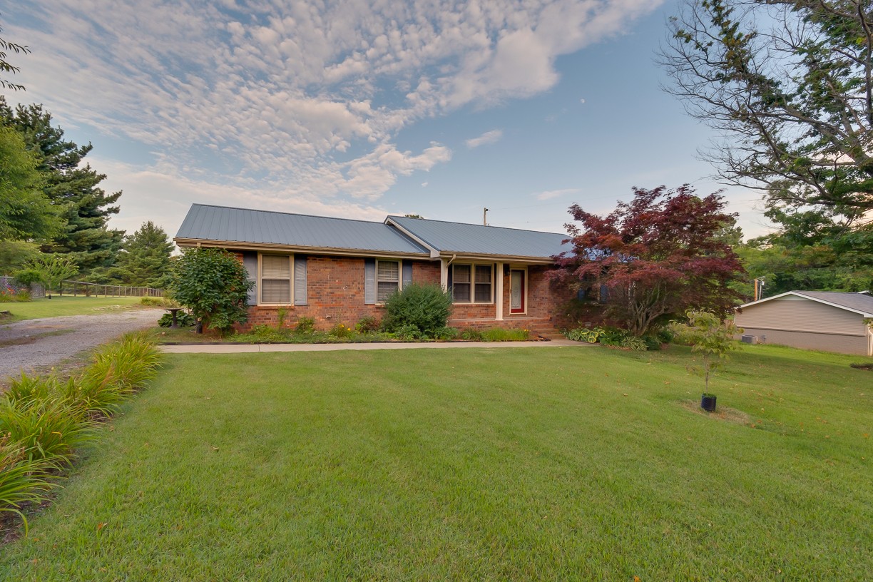 116 Green Acres Road Cottontown, TN 37048 - Photo 7 of 44 a front view of house with outdoor space and yard