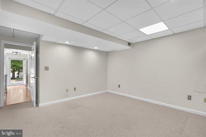 1163 Kelfield Drive, Unit 1163 Baltimore, MD 21227 - Photo 15 of 28 an empty room with windows