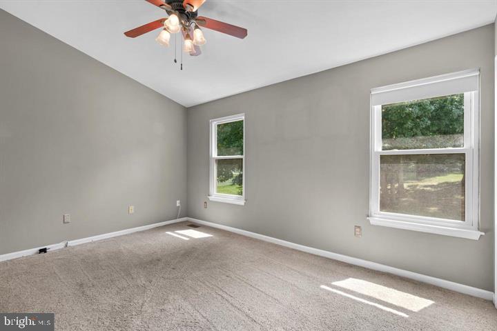 1163 Kelfield Drive, Unit 1163 Baltimore, MD 21227 - Photo 16 of 28 a view of an empty room with a window