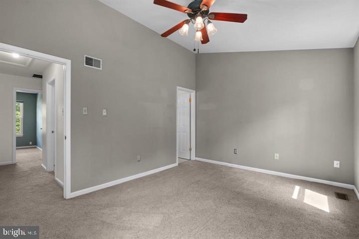 1163 Kelfield Drive, Unit 1163 Baltimore, MD 21227 - Photo 18 of 28 a view of an empty room and chandelier fan