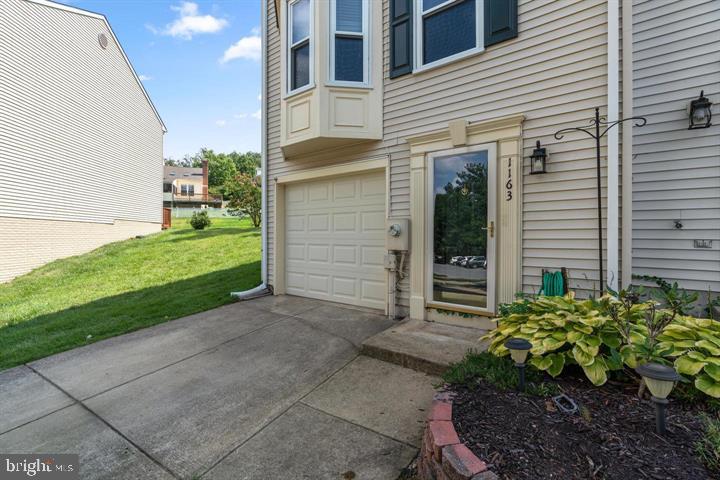1163 Kelfield Drive, Unit 1163 Baltimore, MD 21227 - Photo 2 of 28 a house view with a backyard space