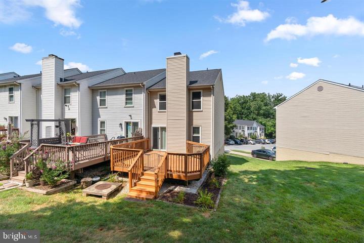 1163 Kelfield Drive, Unit 1163 Baltimore, MD 21227 - Photo 26 of 28 a view of a house with backyard and sitting area