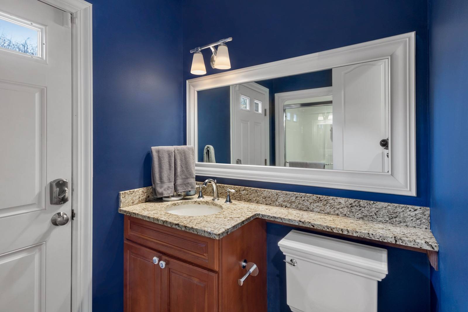 32 A Vail Avenue East Quogue, NY 11942 - Photo 13 of 24 a bathroom with a granite countertop sink and a mirror