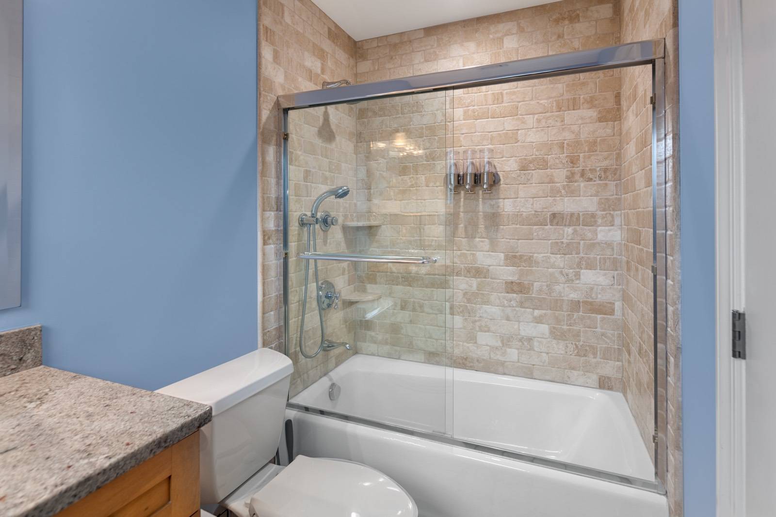 32 A Vail Avenue East Quogue, NY 11942 - Photo 18 of 24 a bathroom with a granite countertop bathtub shower sink vanity and toilet