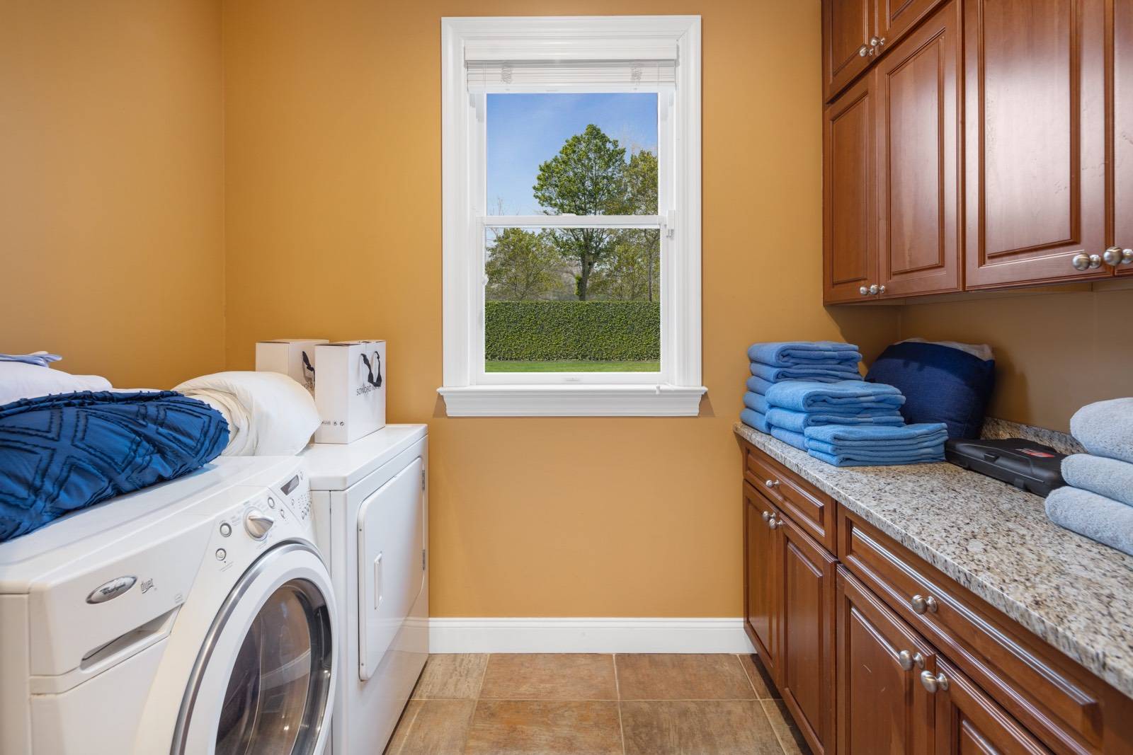 32 A Vail Avenue East Quogue, NY 11942 - Photo 19 of 24 a view of a kitchen with washer and dryer