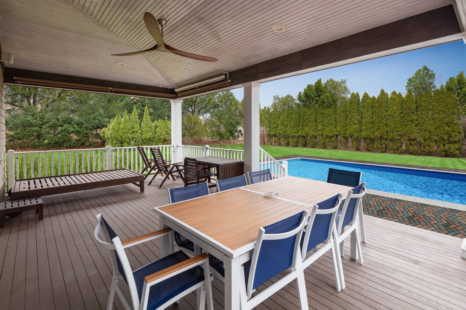 32 A Vail Avenue East Quogue, NY 11942 - Photo 2 of 24 a view of a patio with a table chairs and a table