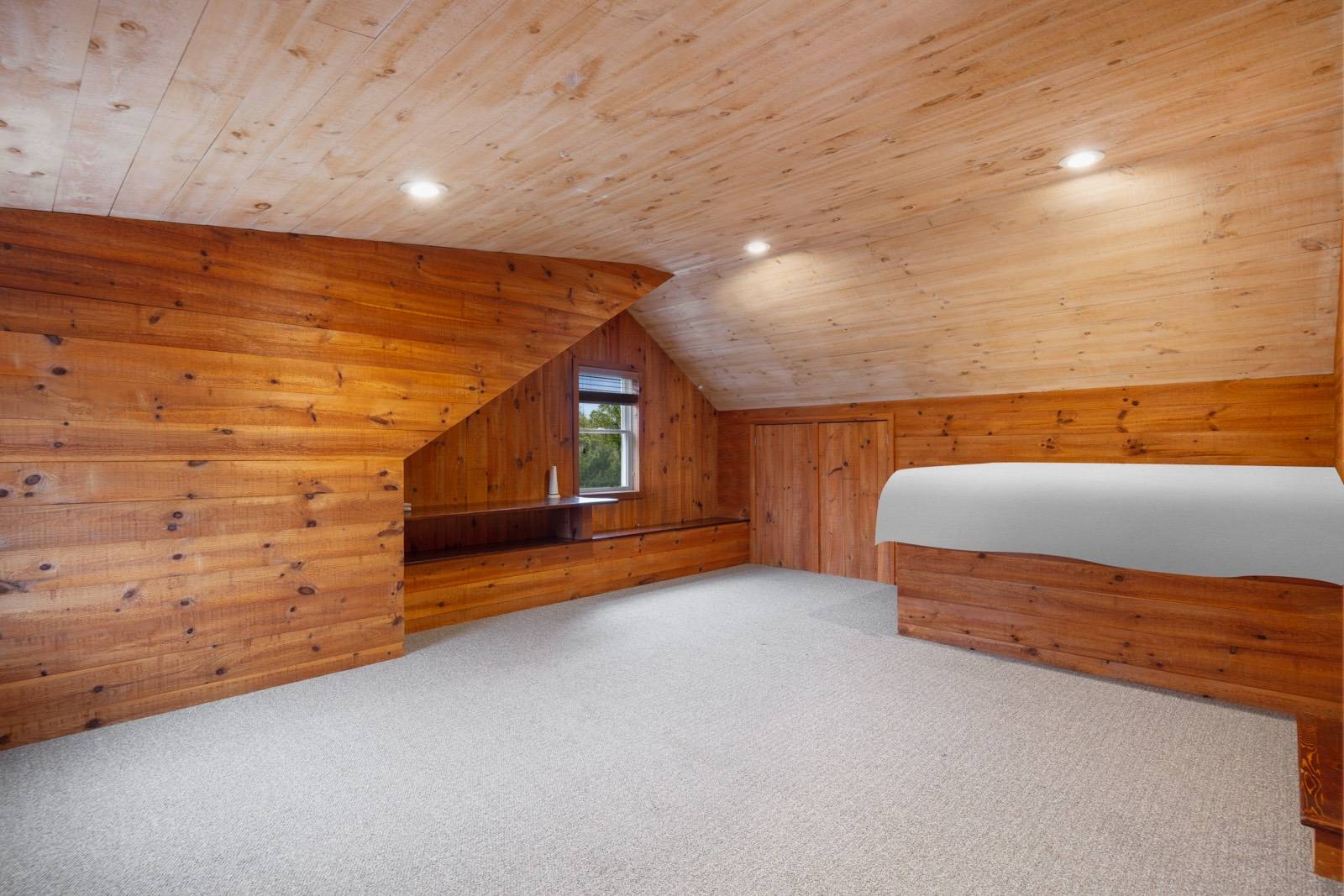 32 A Vail Avenue East Quogue, NY 11942 - Photo 22 of 24 a bedroom with a bed and dresser