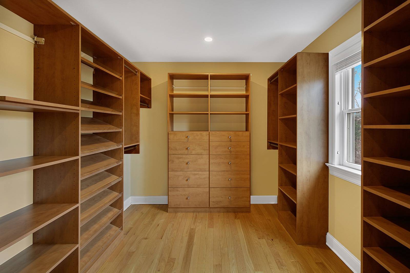 32 A Vail Avenue East Quogue, NY 11942 - Photo 10 of 24 a view of walk in closet with empty racks
