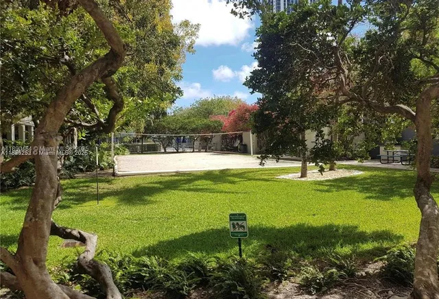 a swimming pool with outdoor seating and yard