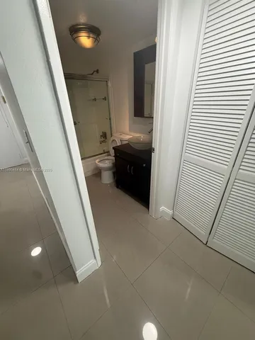 a view of a hallway with stairs