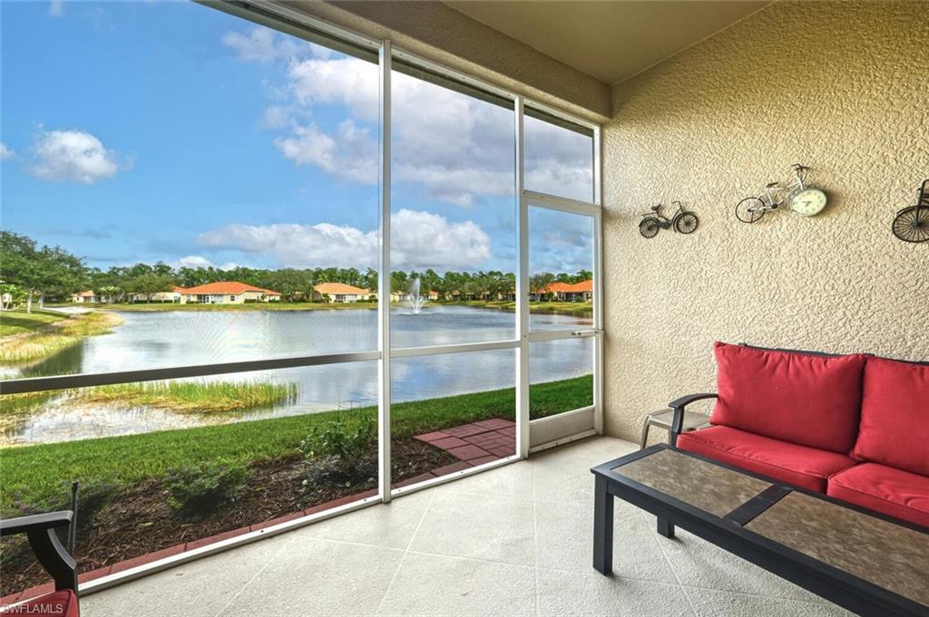 8063 Sanctuary Drive, Unit 1 Naples, FL 34104 - Photo 15 of 30 Sunroom / solarium with a water view