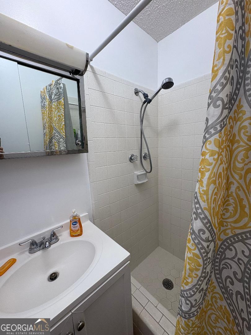 2103 Aimwell Road Vidalia, GA 30474 - Photo 12 of 22 a bathroom with a sink and a shower