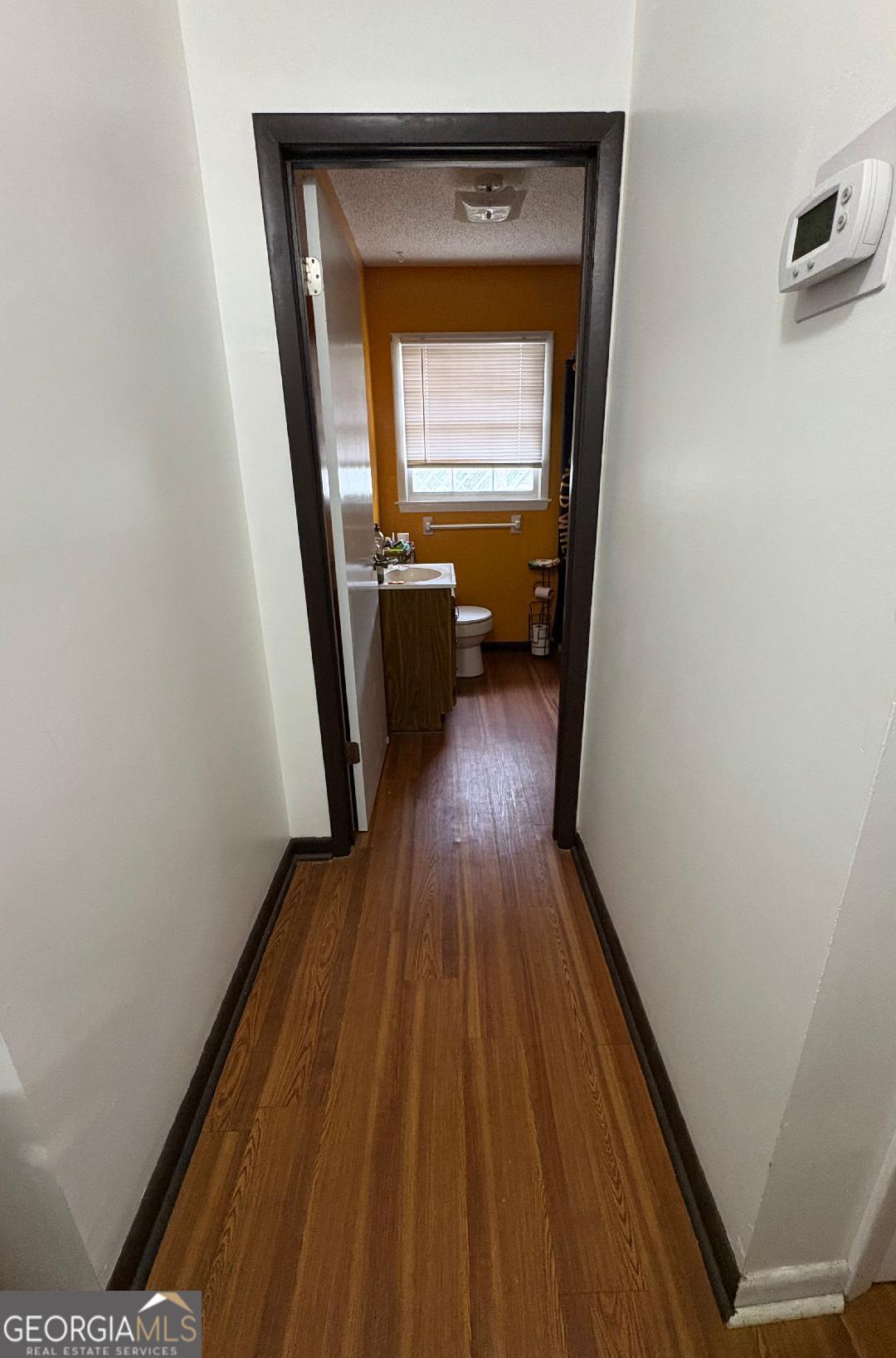 2103 Aimwell Road Vidalia, GA 30474 - Photo 17 of 22 a view of a hallway and wooden floor