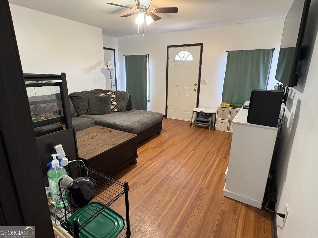 2103 Aimwell Road Vidalia, GA 30474 - Photo 20 of 22 a living room with furniture and wooden floor