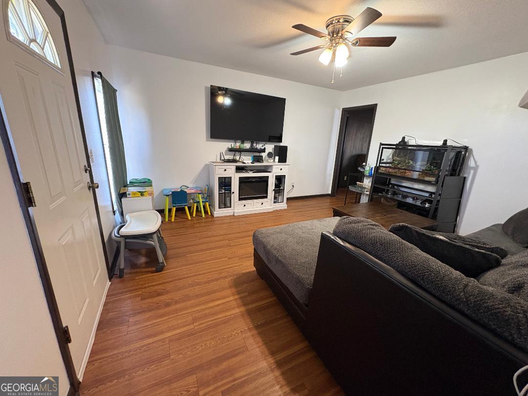 2103 Aimwell Road Vidalia, GA 30474 - Photo 21 of 22 a living room with furniture and a flat screen tv
