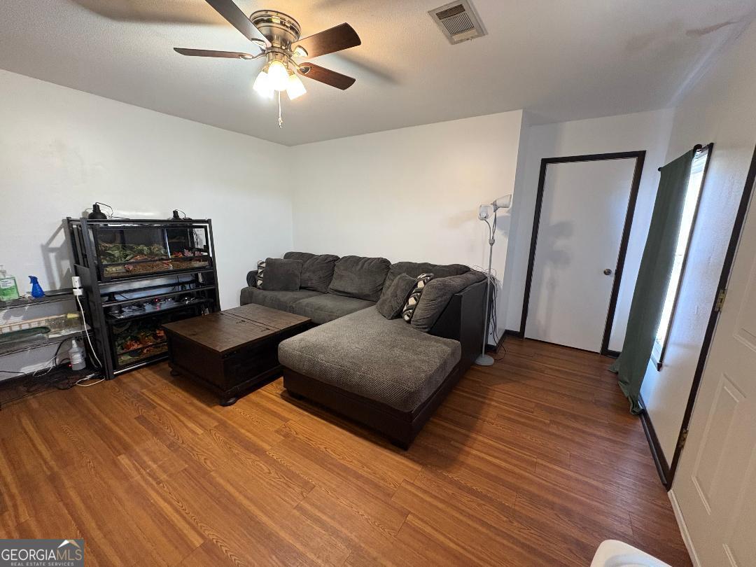 2103 Aimwell Road Vidalia, GA 30474 - Photo 22 of 22 a living room with furniture and a piano