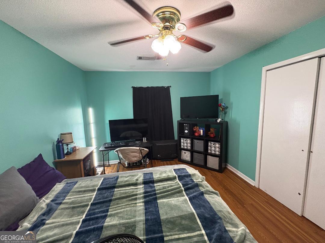 2103 Aimwell Road Vidalia, GA 30474 - Photo 8 of 22 a bedroom with a bed and a flat screen tv