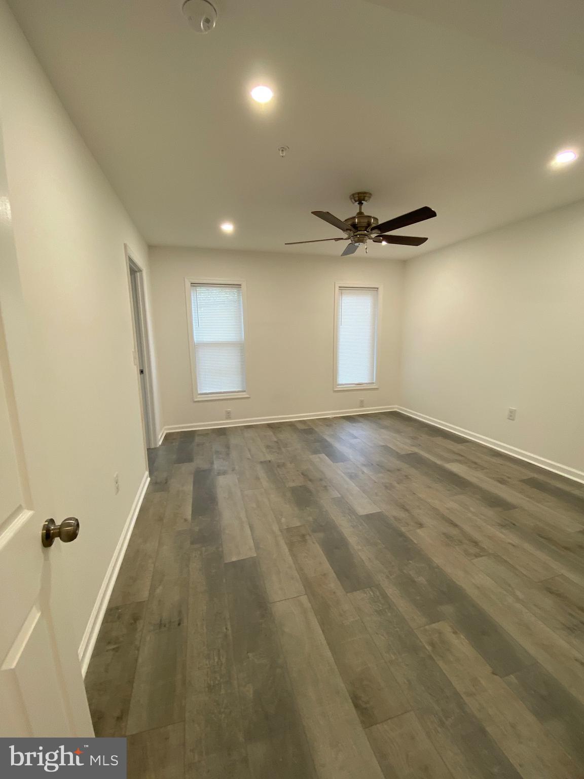 45 East High Street, Unit 2ND & 3 Pottstown, PA 19464 - Photo 29 of 34 a view of a livingroom with a ceiling fan and window