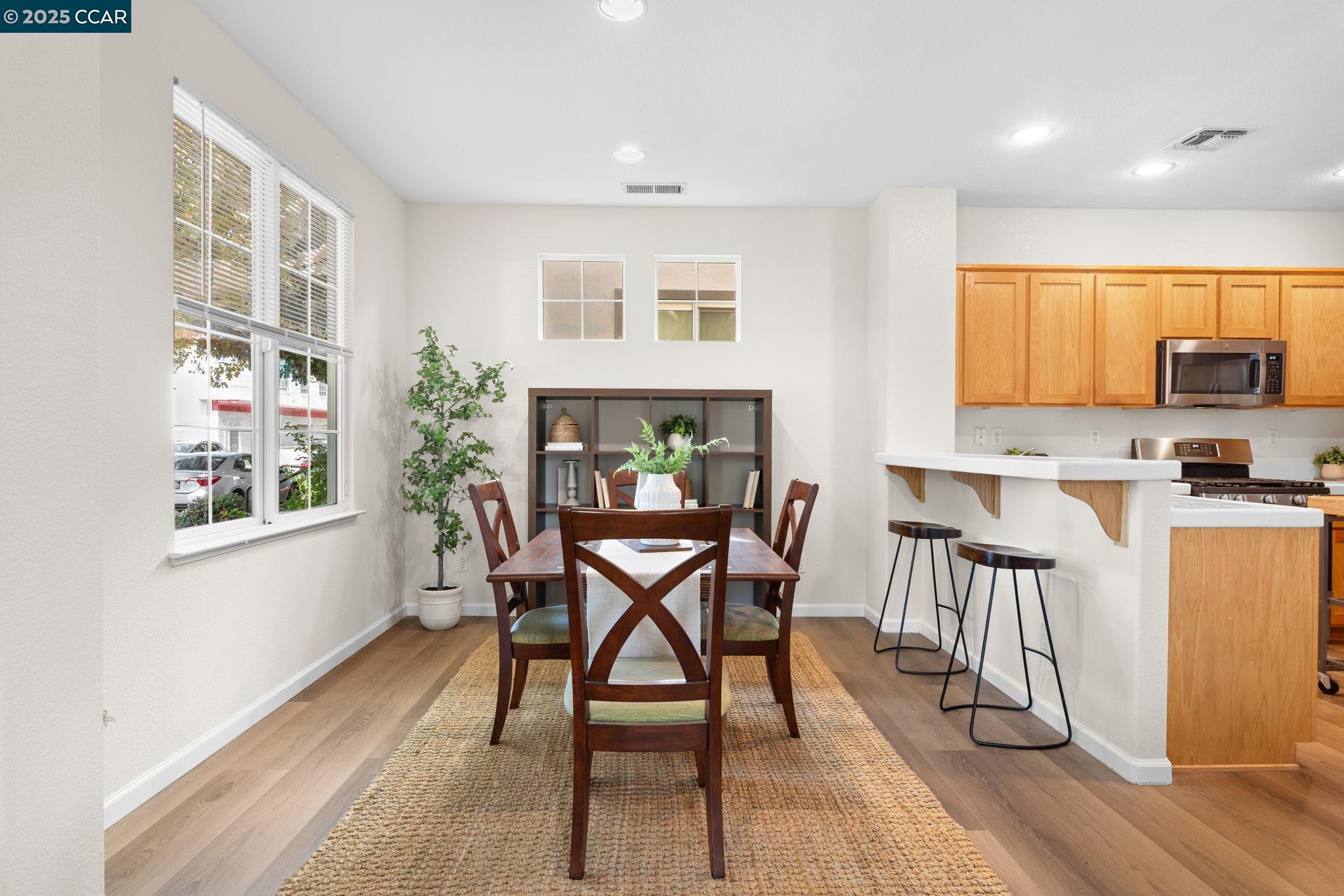 2805 Euclid Avenue Concord, CA 94519 - Photo 14 of 46 a view of a dining room with furniture and wooden floor