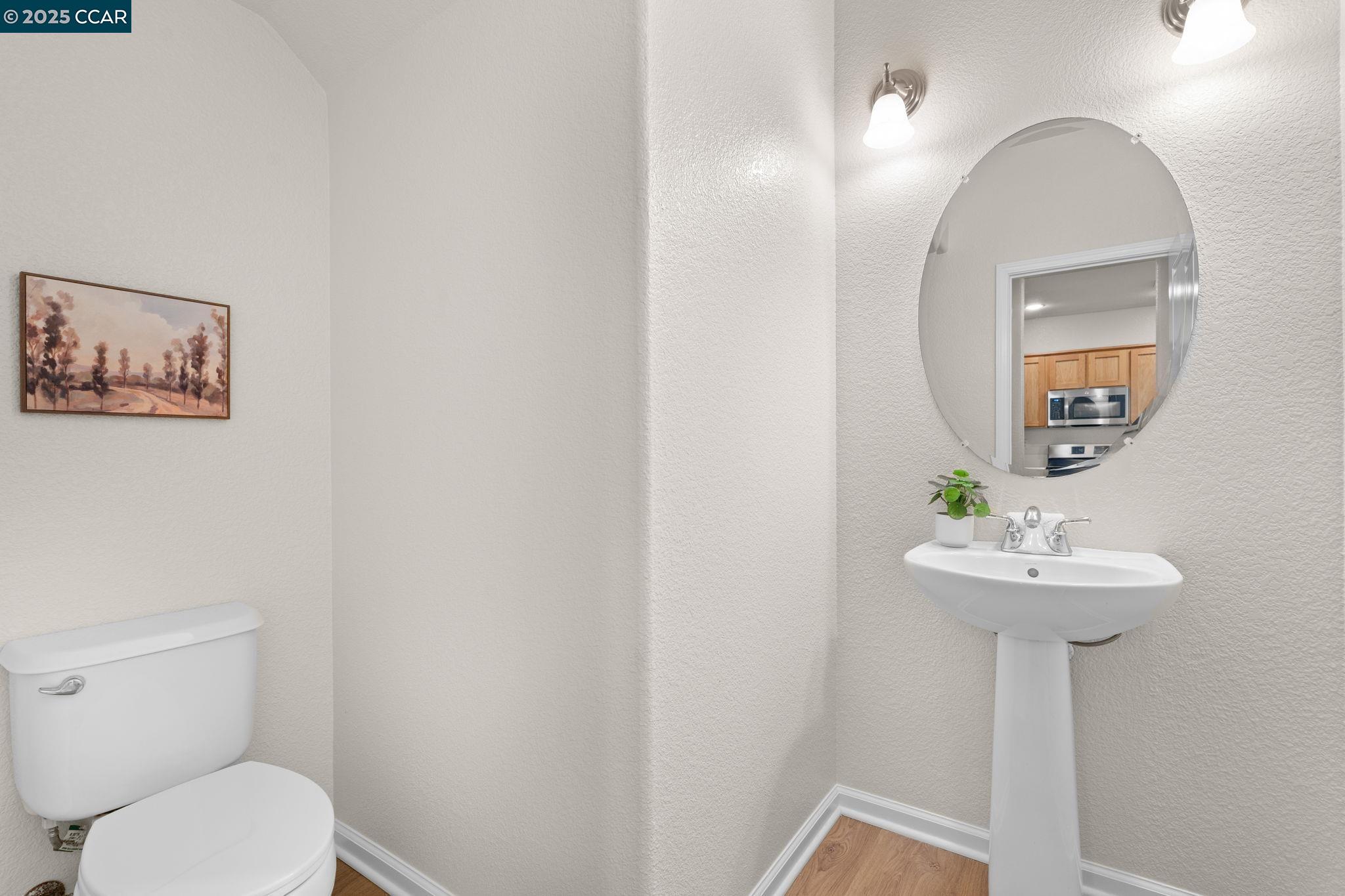 2805 Euclid Avenue Concord, CA 94519 - Photo 19 of 46 a bathroom with a sink mirror and toilet