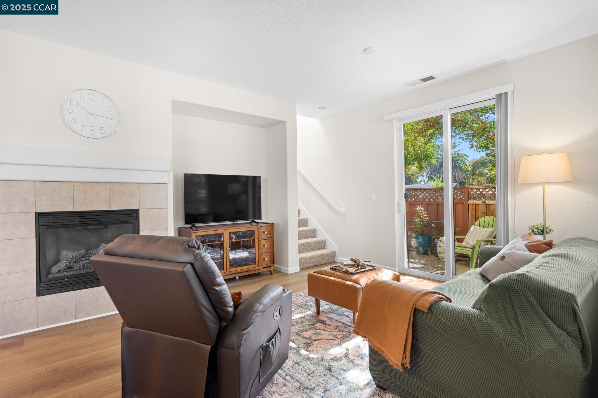 2805 Euclid Avenue Concord, CA 94519 - Photo 6 of 46 a living room with furniture a flat screen tv and a fireplace