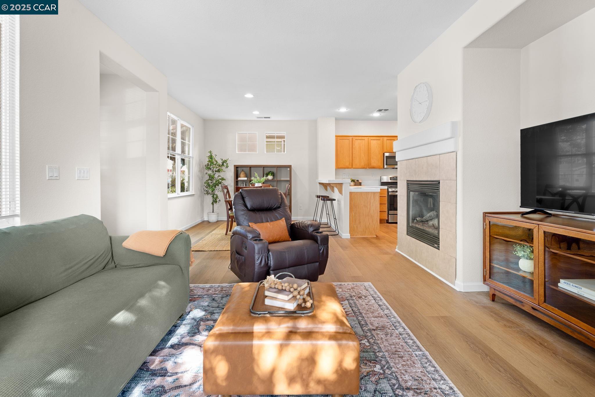 2805 Euclid Avenue Concord, CA 94519 - Photo 9 of 46 a living room with furniture a flat screen tv and a fireplace