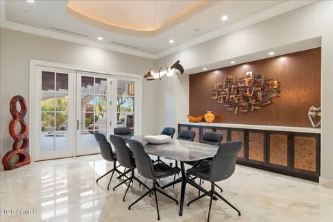 a kitchen with a sink cabinets and wooden floor