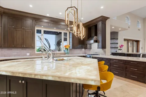 a bathroom with a sink a mirror and vanity