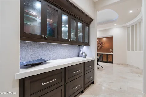 a large bathroom with a large tub and sink