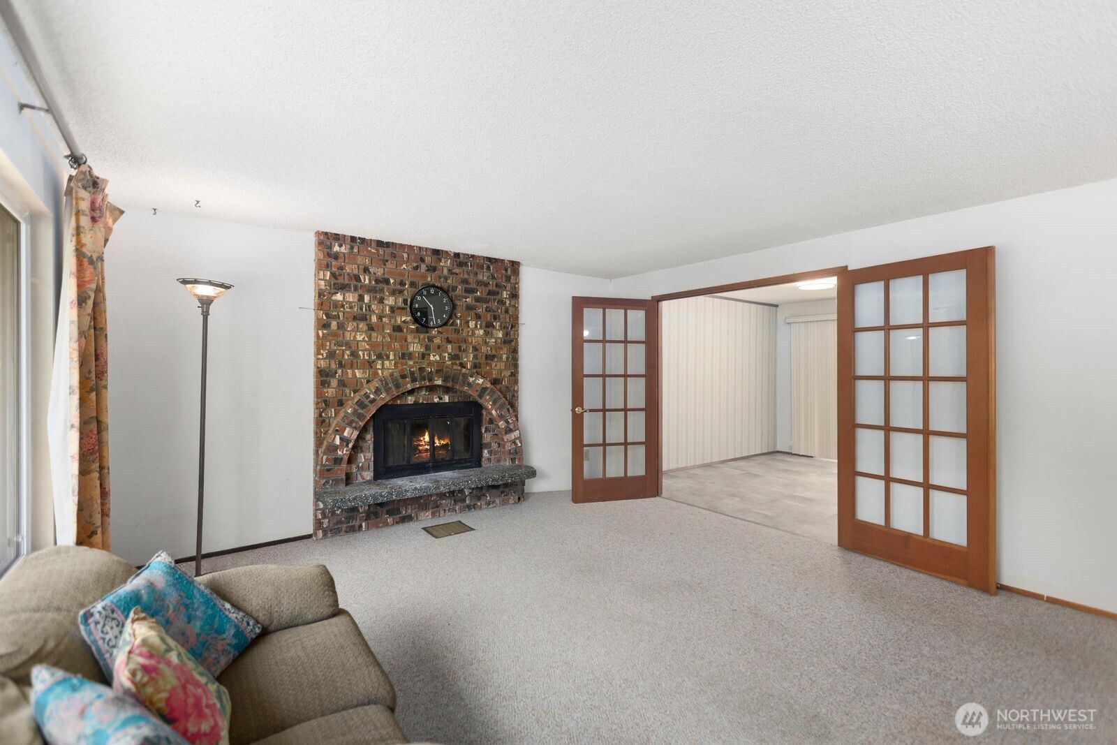 21627 9th Place West Bothell, WA 98021 - Photo 10 of 40 a living room with furniture a fireplace and a window