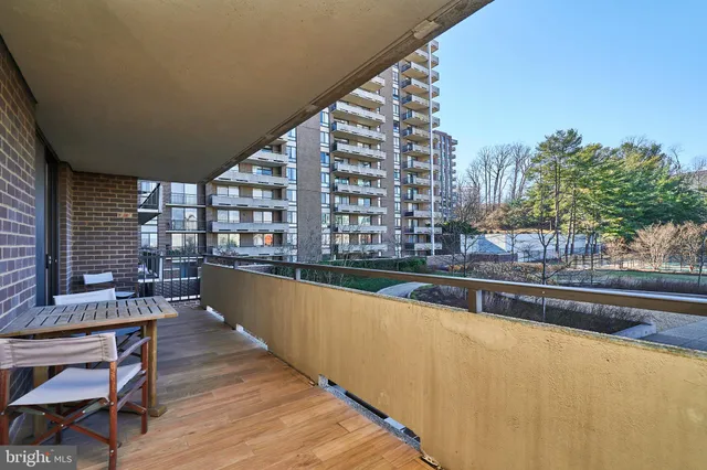 a view of balcony with outdoor seating and city view