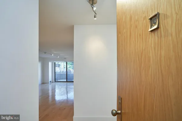 a view of livingroom with hardwood floor and hallway