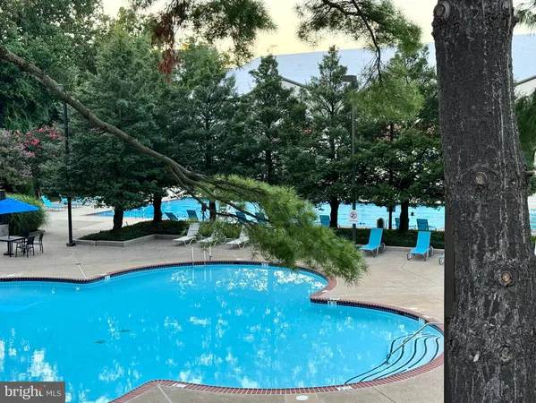 a view of a swimming pool with a patio