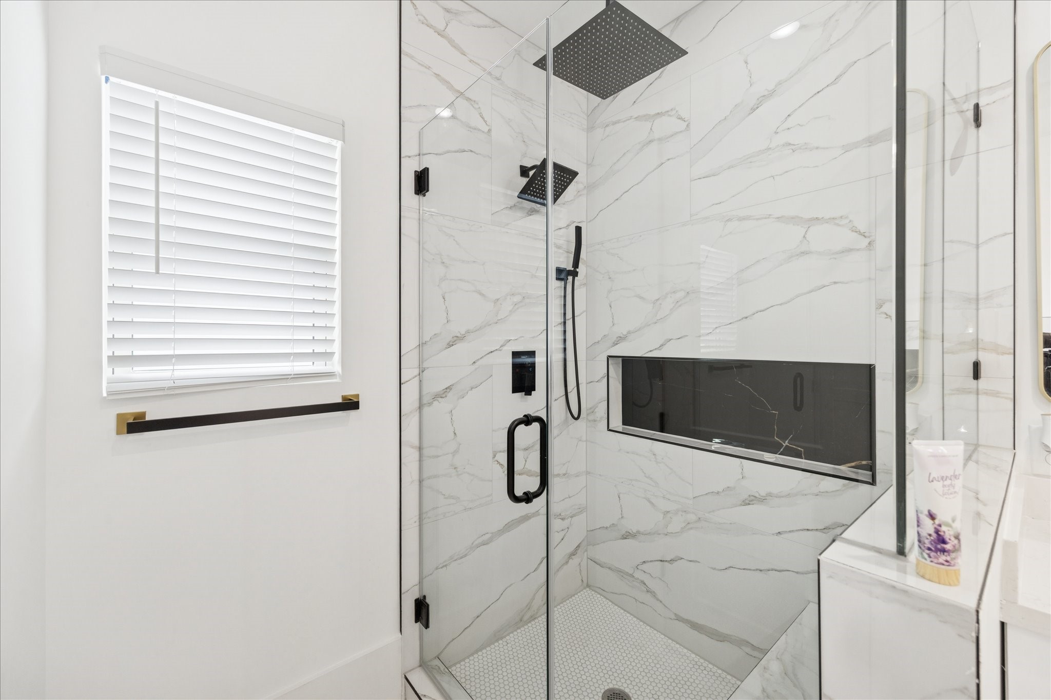 9233 Madera Road Houston, TX 77078 - Photo 15 of 25 a bathroom with a shower and mirror