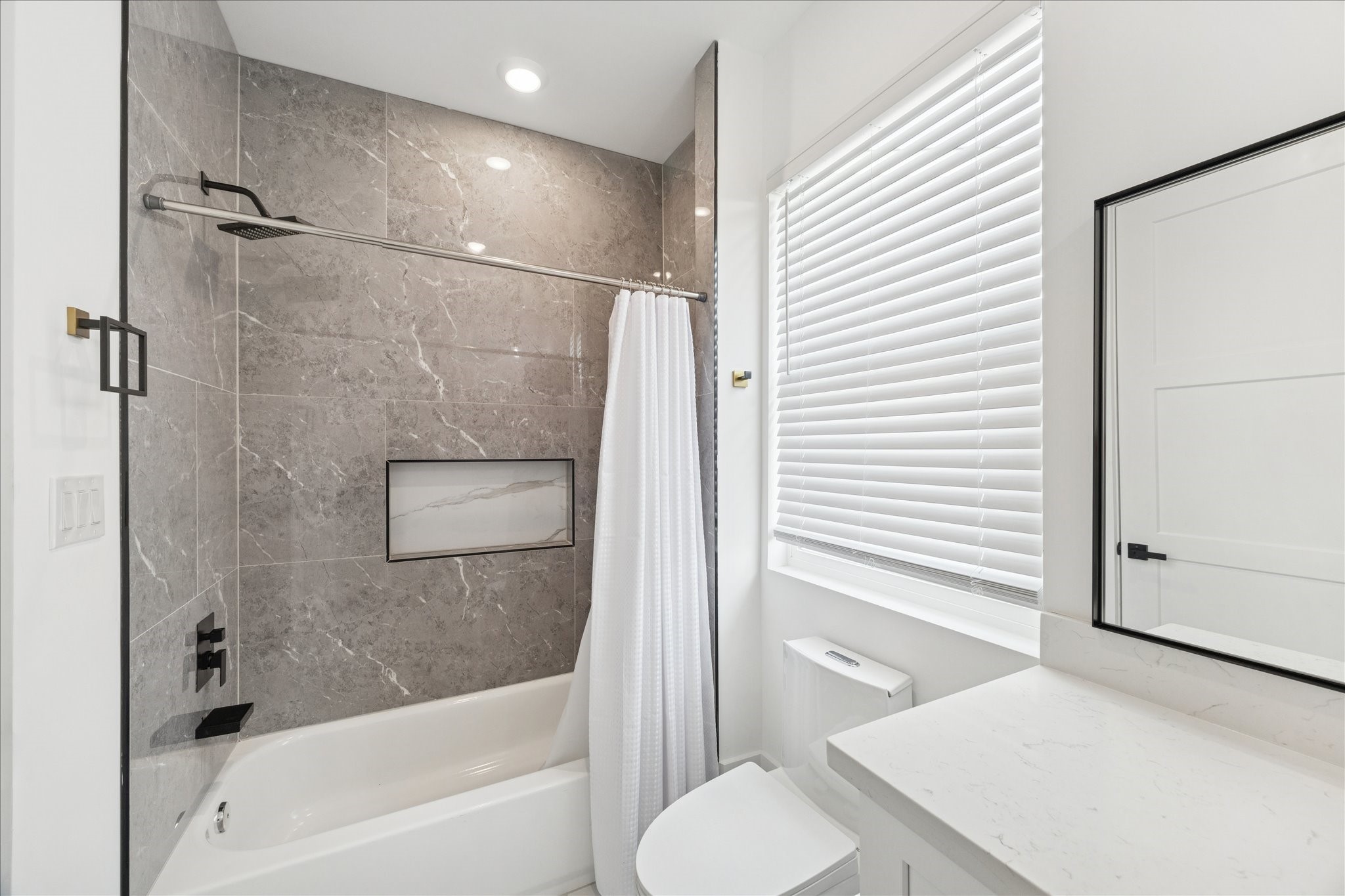 9233 Madera Road Houston, TX 77078 - Photo 22 of 25 a bathroom with a sink toilet and shower