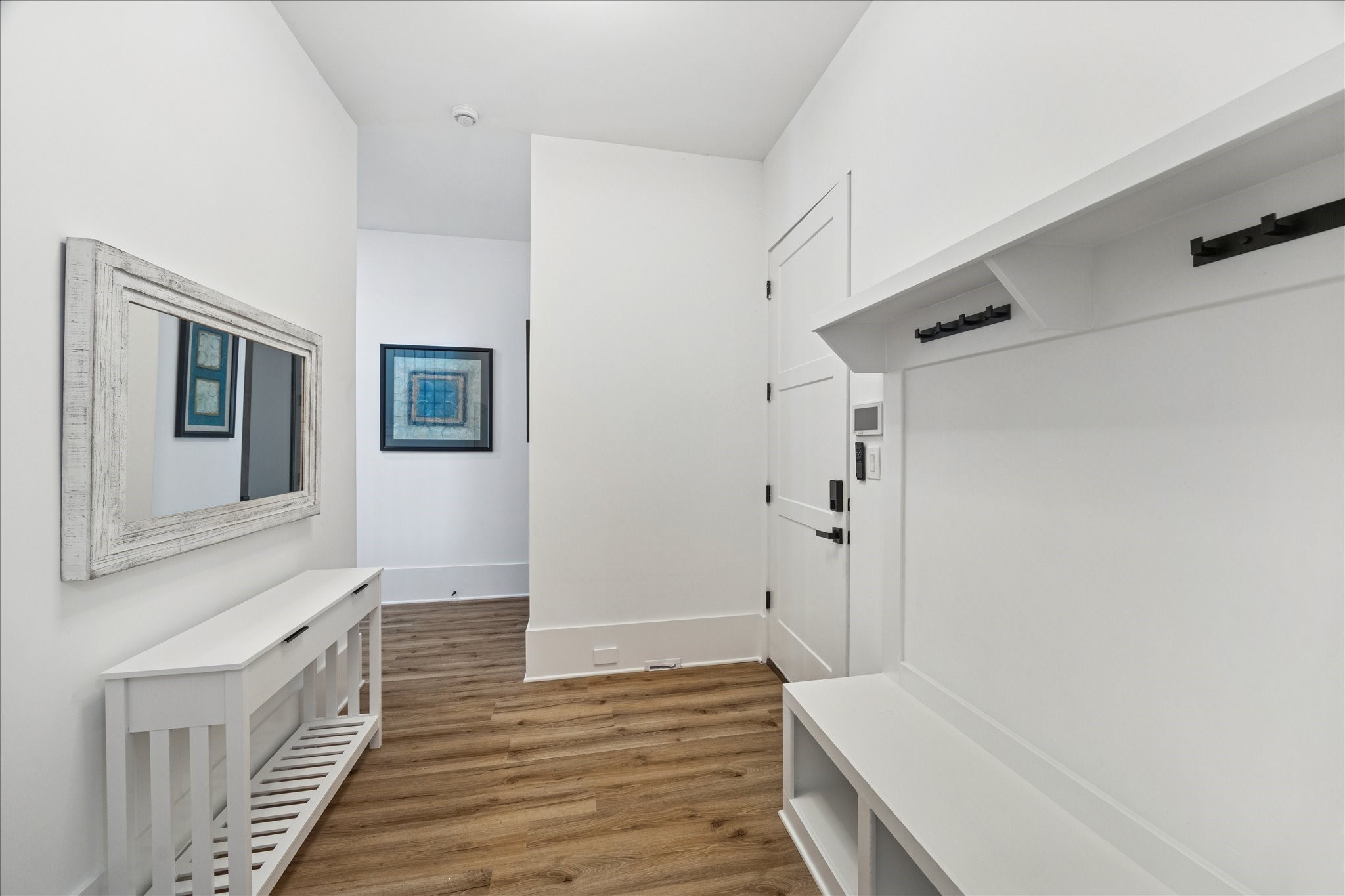 9233 Madera Road Houston, TX 77078 - Photo 6 of 25 a view of a hallway with wooden floor and staircase