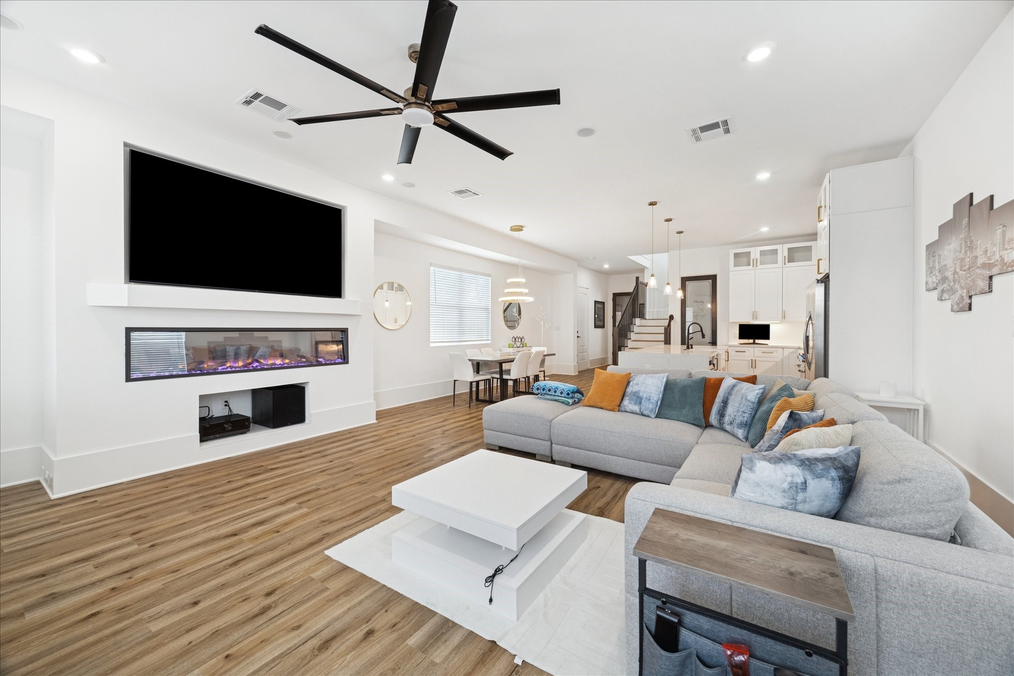 9233 Madera Road Houston, TX 77078 - Photo 7 of 25 a living room with furniture a fireplace and a flat screen tv
