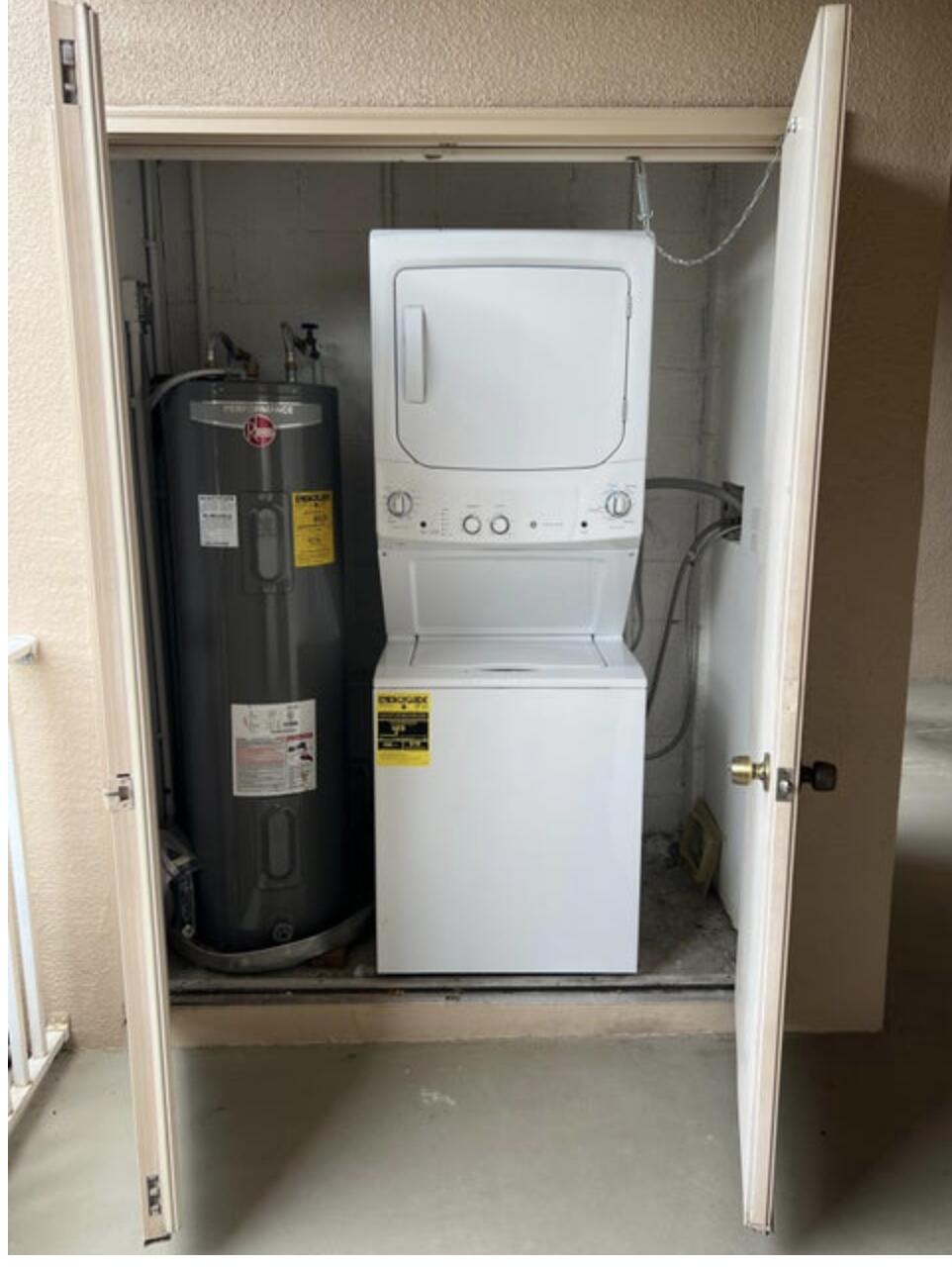 9871 Perfect Drive, Unit 144 Port St. Lucie, FL 34986 - Photo 11 of 11 a utility room with dryer and washer