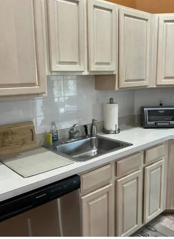 a view of a dining room with furniture wooden floor and chandelier