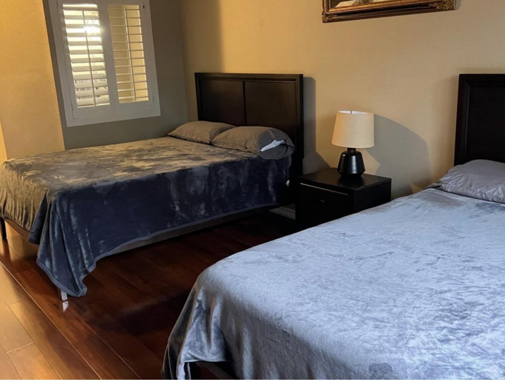 9871 Perfect Drive, Unit 144 Port St. Lucie, FL 34986 - Photo 9 of 11 a bedroom with a bed and window