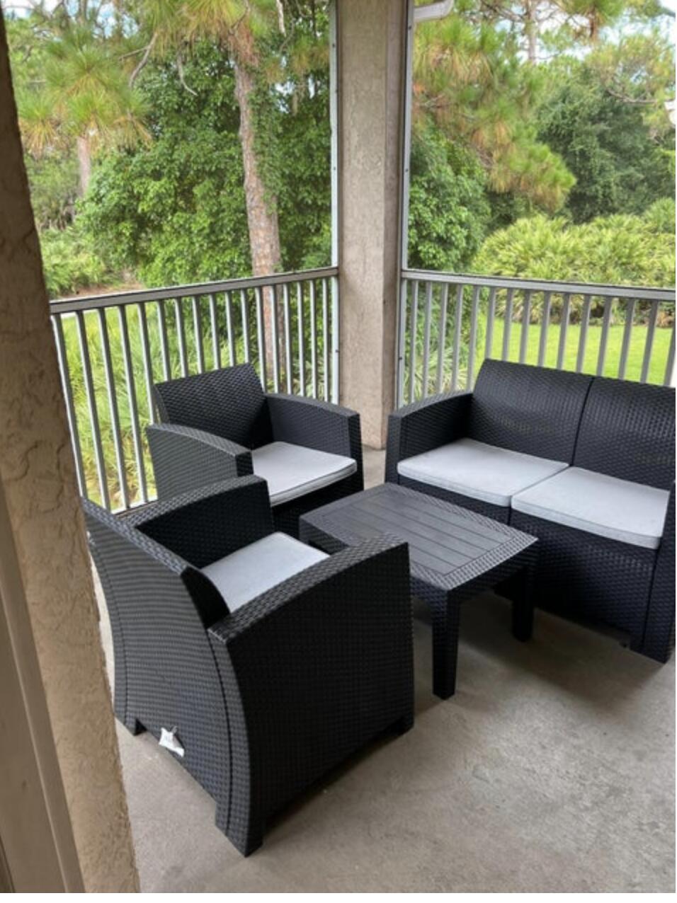 9871 Perfect Drive, Unit 144 Port St. Lucie, FL 34986 - Photo 10 of 11 a view of a balcony with chairs