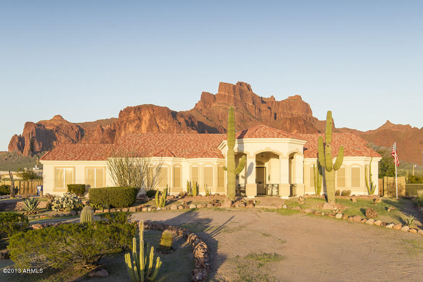 365 North Muleshoe Road Apache Junction, AZ 85119 - Photo 1 of 54 a view of a house with swimming pool and sitting area