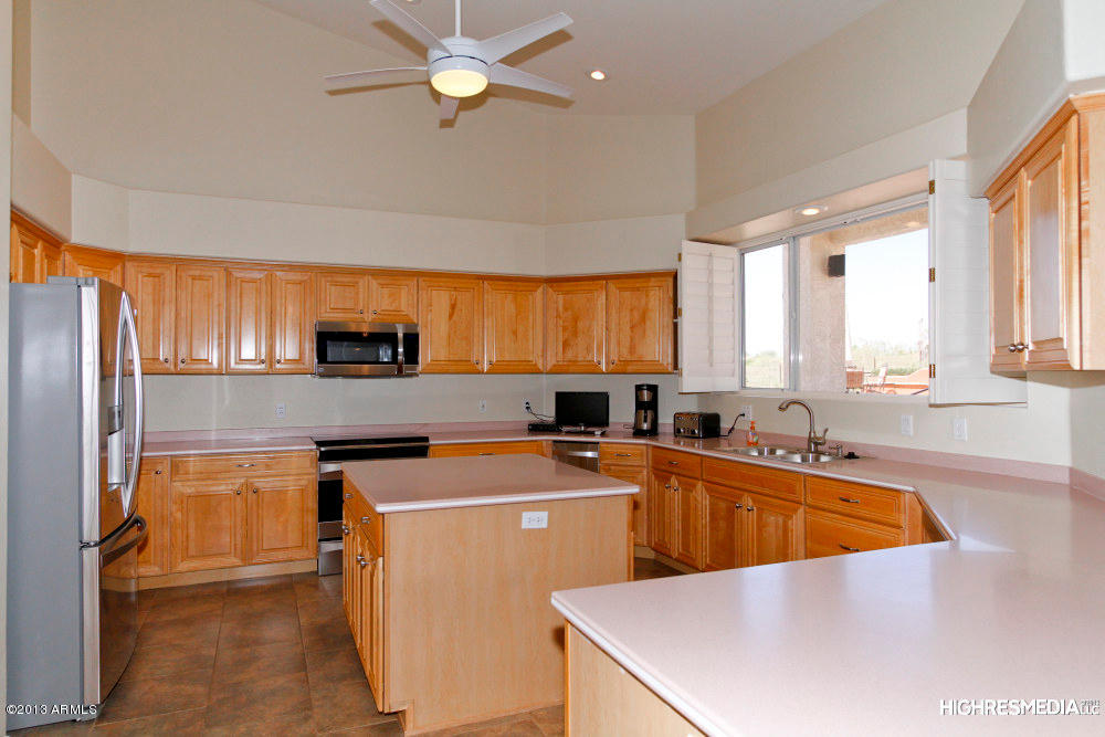 365 North Muleshoe Road Apache Junction, AZ 85119 - Photo 24 of 54 a view of a kitchen with a sink dishwasher microwave stove and cabinets