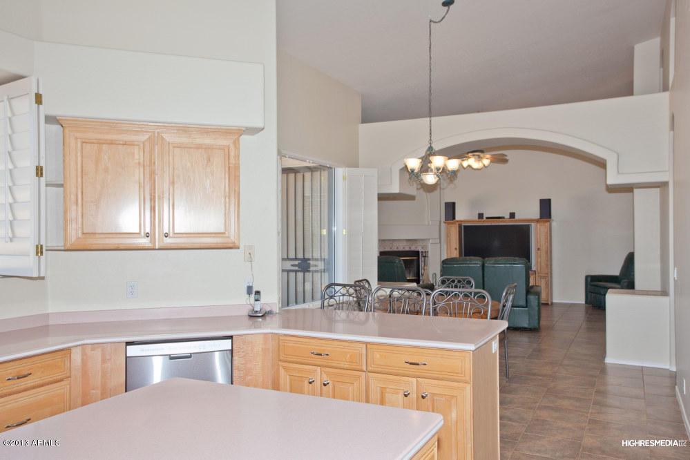 365 North Muleshoe Road Apache Junction, AZ 85119 - Photo 26 of 54 a kitchen with a sink and chandelier