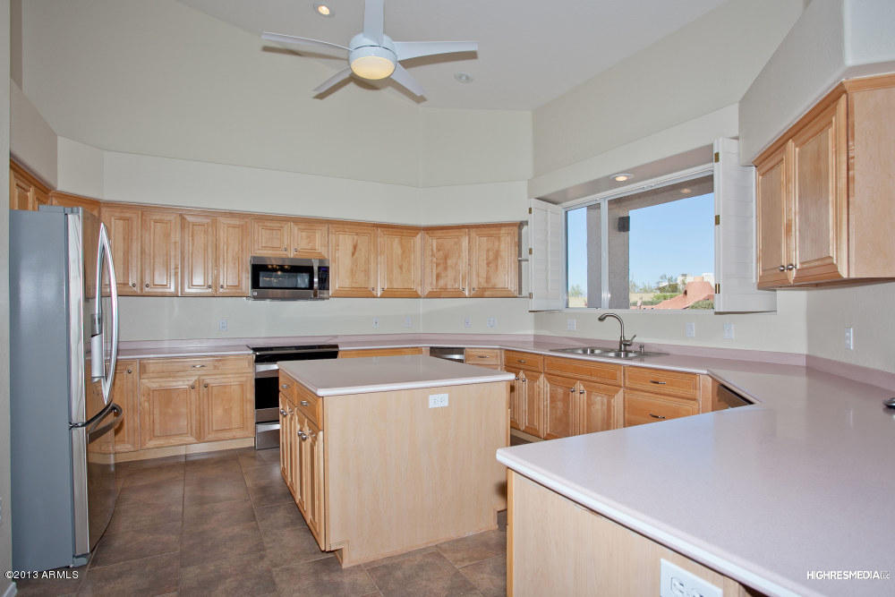 365 North Muleshoe Road Apache Junction, AZ 85119 - Photo 28 of 54 a kitchen that has a sink and a stove in it