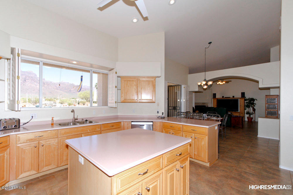 365 North Muleshoe Road Apache Junction, AZ 85119 - Photo 29 of 54 a kitchen with a stove a sink and a refrigerator