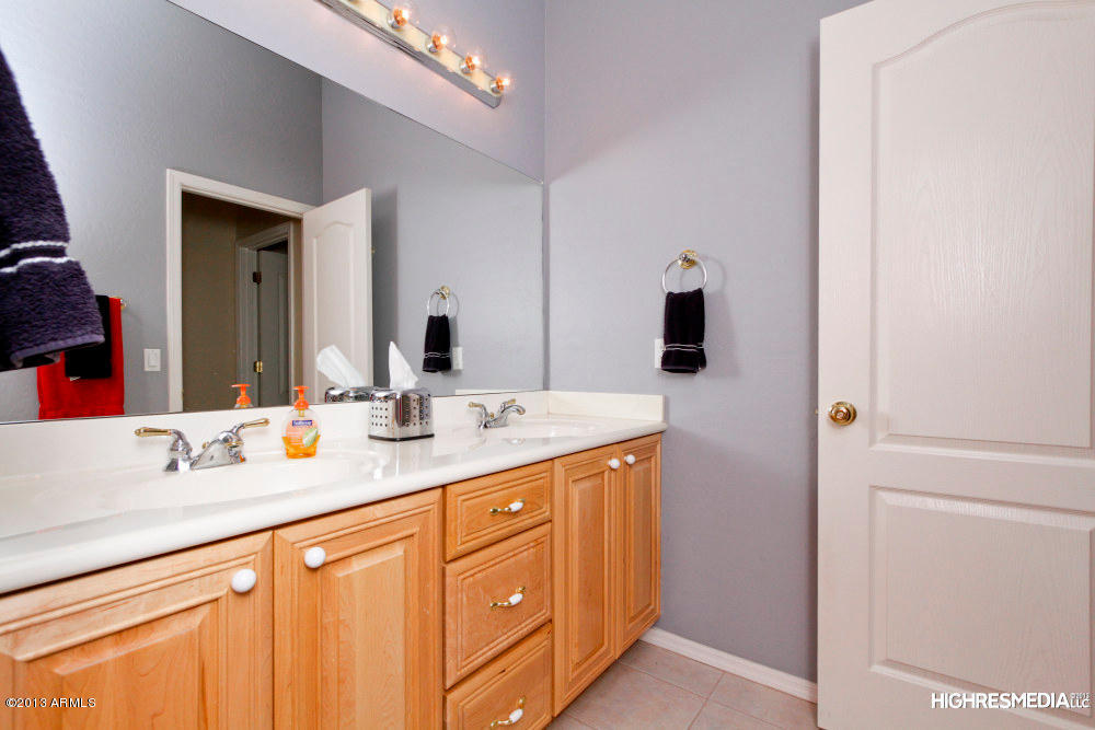 365 North Muleshoe Road Apache Junction, AZ 85119 - Photo 34 of 54 a bathroom with a sink and a mirror