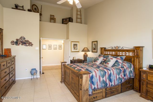 365 North Muleshoe Road Apache Junction, AZ 85119 - Photo 35 of 54 a bed room with a bed and a couch