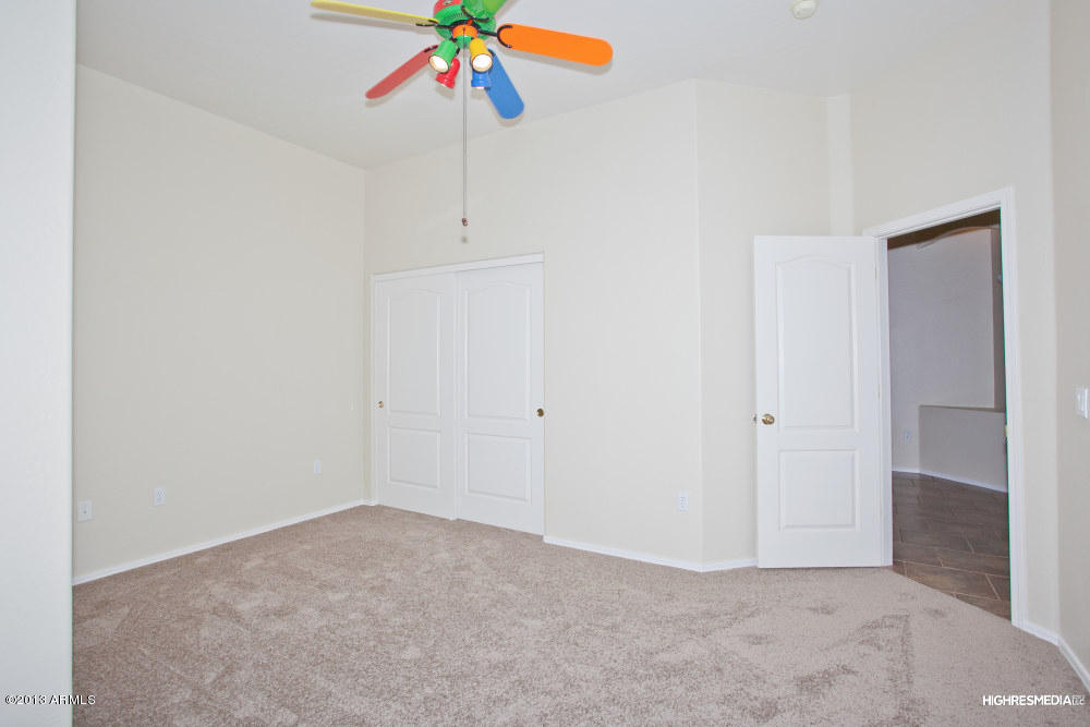 365 North Muleshoe Road Apache Junction, AZ 85119 - Photo 45 of 54 an empty room with a ceiling fan and bathroom