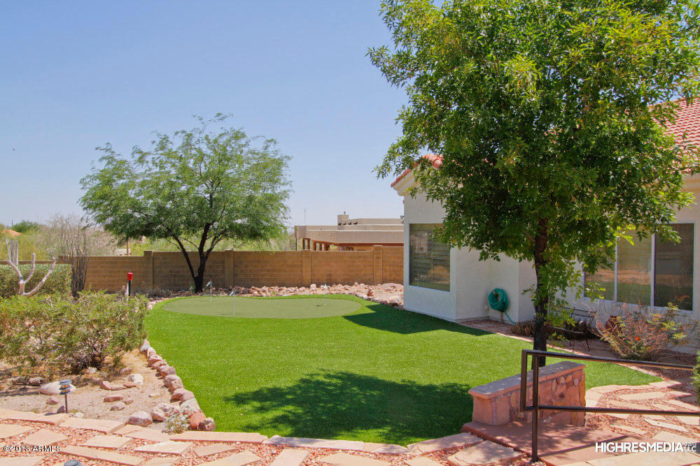 365 North Muleshoe Road Apache Junction, AZ 85119 - Photo 5 of 54 a view of a house with a yard and sitting area